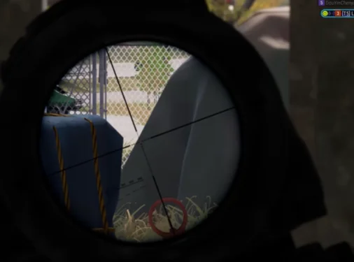 Long-range target highlight PUBG sniper scope view with red enemy target indicator on a distant player